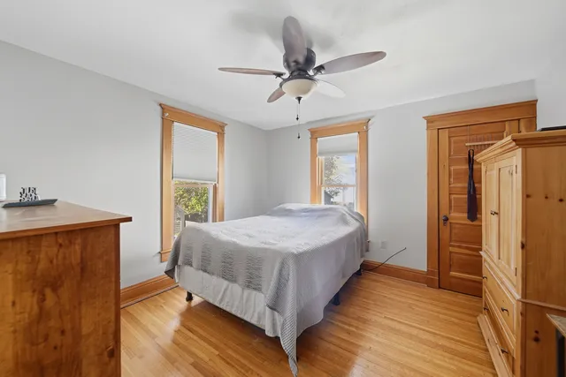 a bedroom with a bed and window