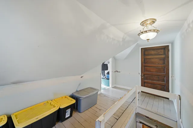 a view of an empty room and bathroom