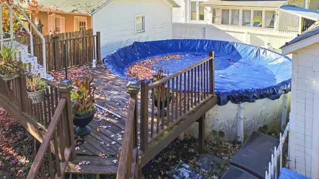 a view of a house with wooden fence