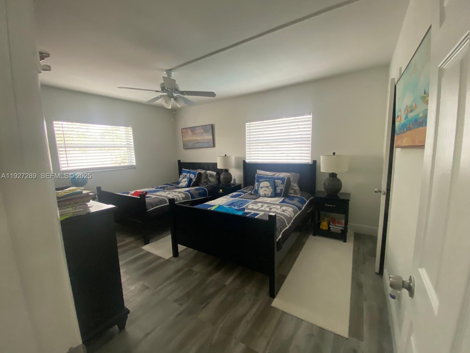 1641 Northwest 9th Street Boca Raton, FL 33486 - Photo 7 of 11 a living room with a couch and a table