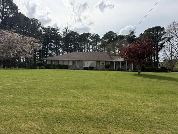 a view of a house with a big yard