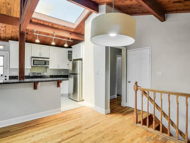 a view of a kitchen with a sink and dishwasher