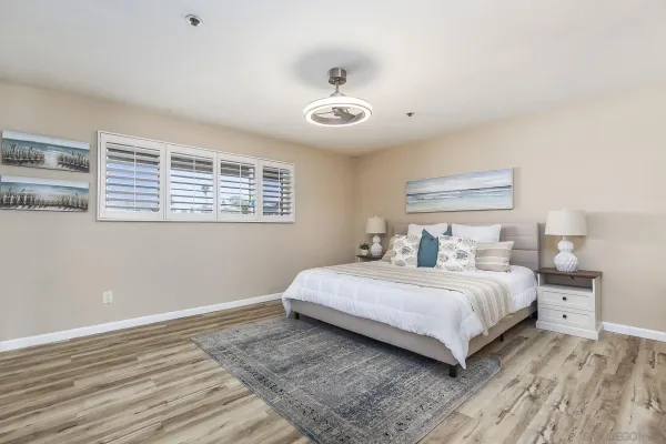a bedroom with a bed and a sink