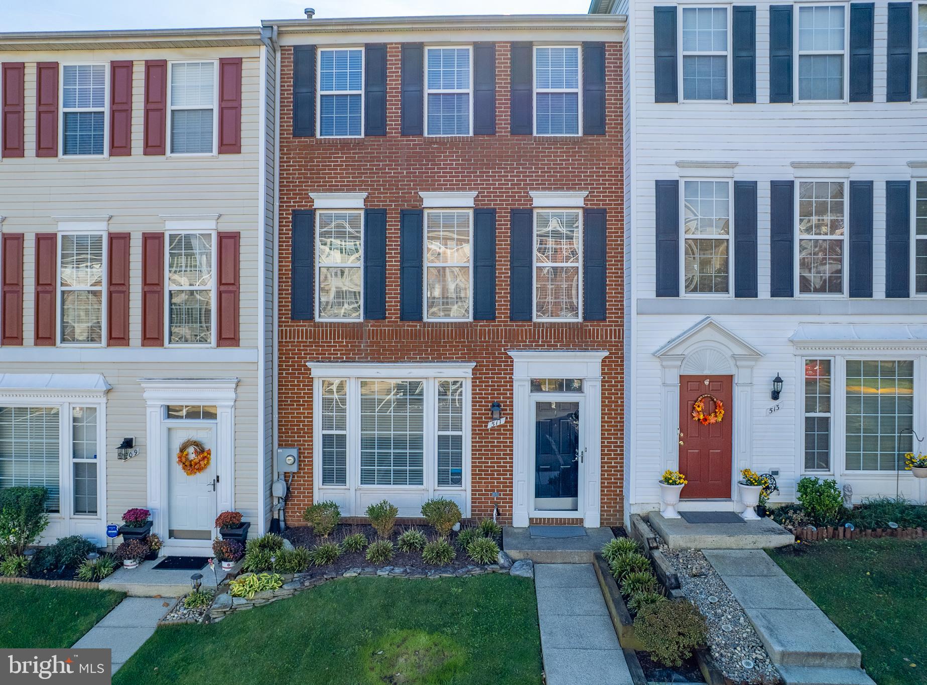 a front view of a building with yard and entertaining space