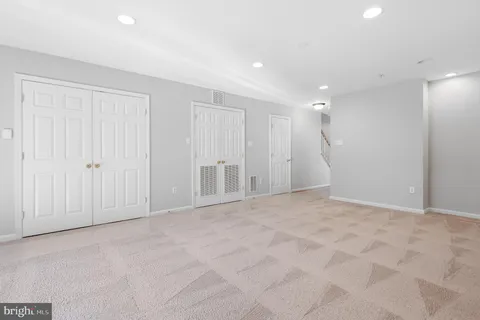 a view of a kitchen with a sink and a chandelier fan