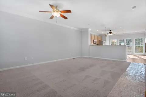 a bathroom with a granite countertop sink a mirror and a shower