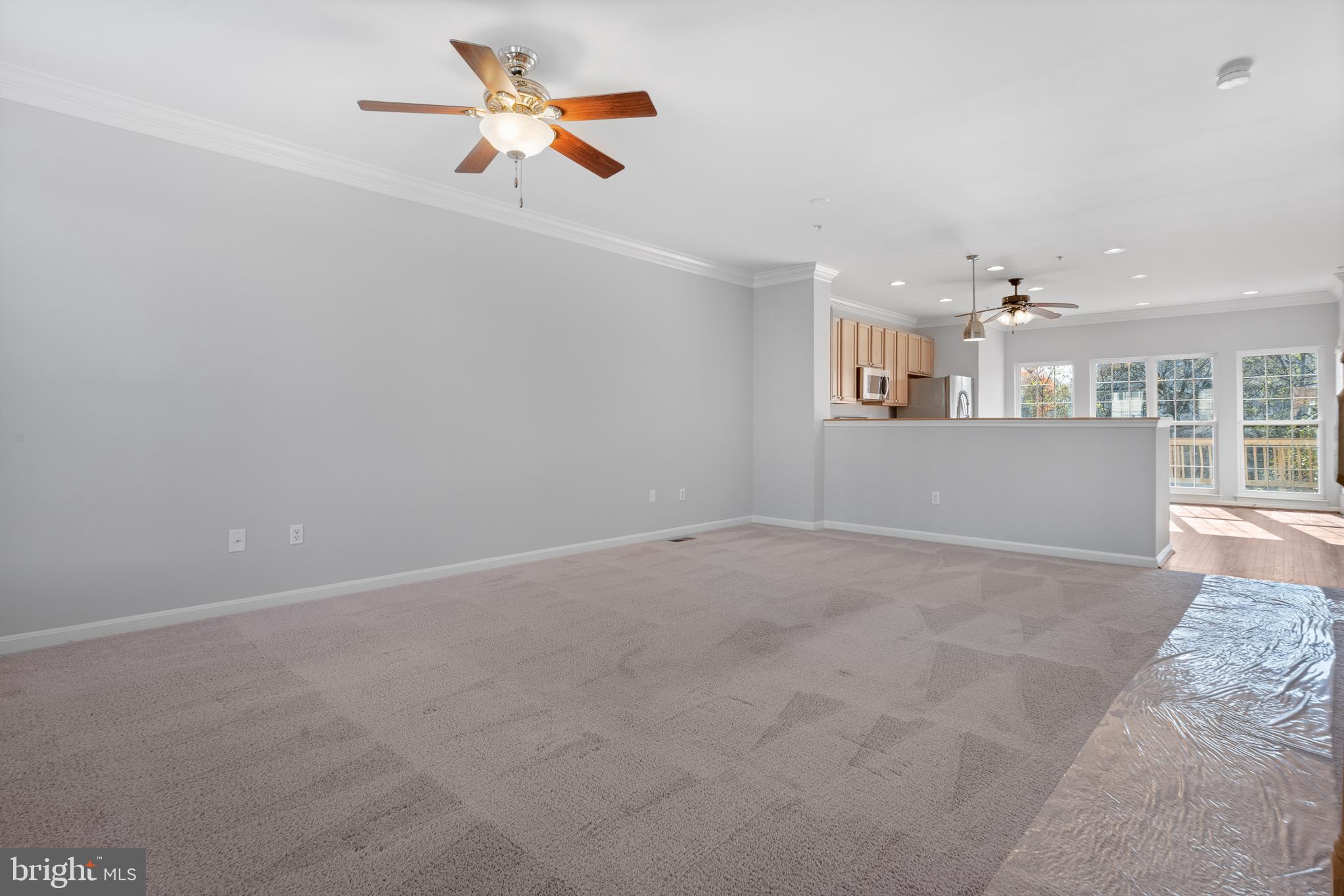 511 Ellison Court Frederick, MD 21703 - Photo 29 of 79 a view of a kitchen with a sink and a chandelier fan
