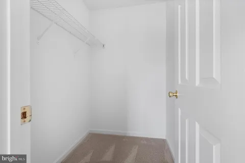 a front view of a residential apartment building with a yard