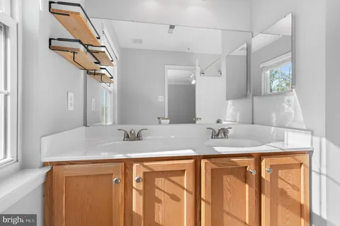 a view of a house with wooden deck