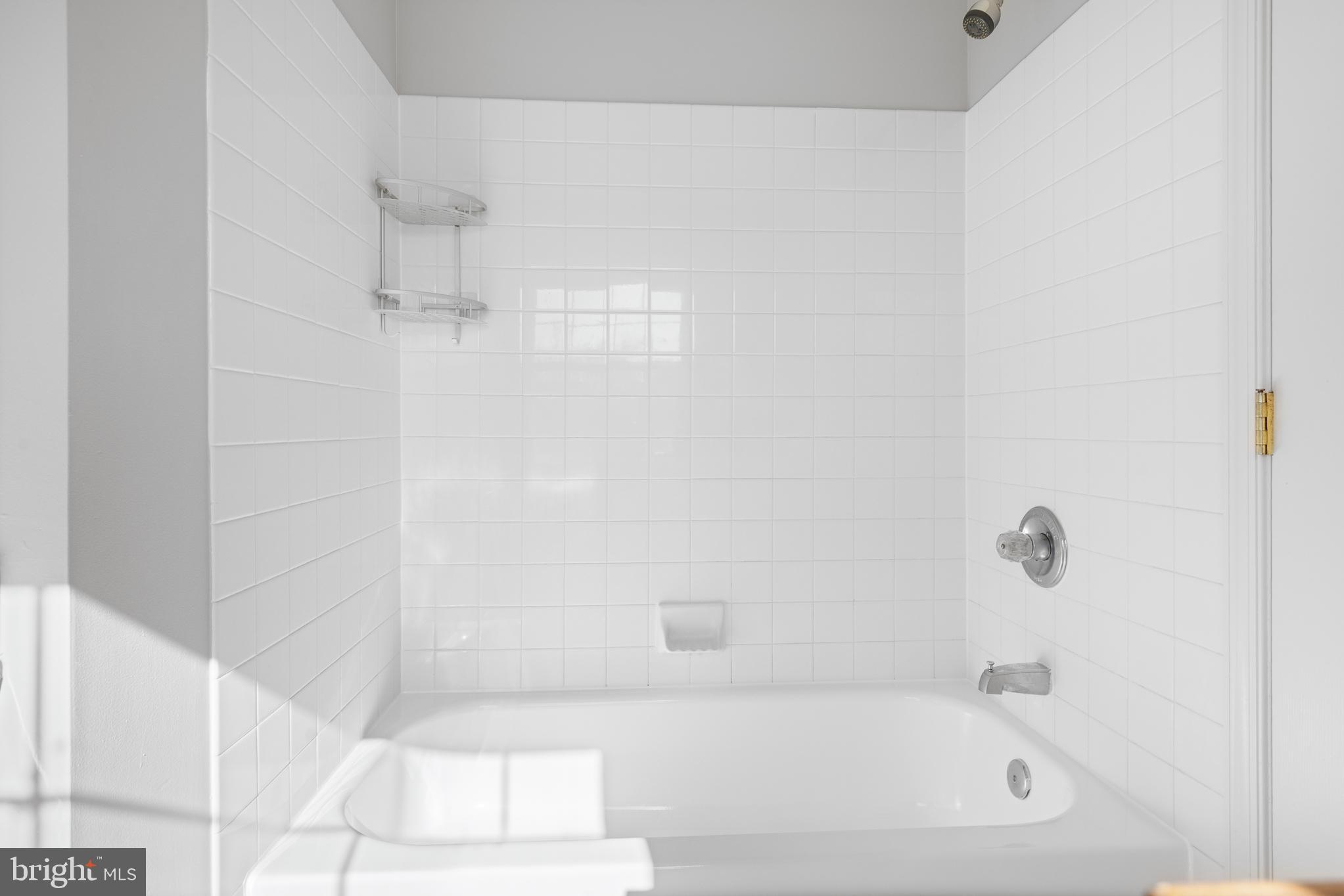 511 Ellison Court Frederick, MD 21703 - Photo 48 of 79 a white bath tub sitting next to a white sink