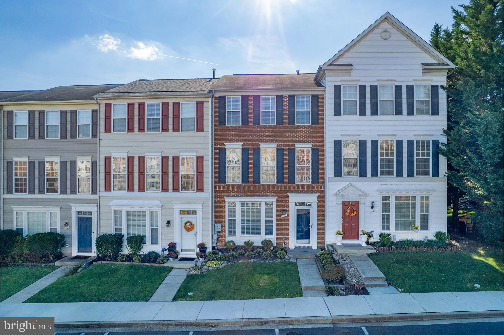 511 Ellison Court Frederick, MD 21703 - Photo 64 of 79 a front view of a residential apartment building with a yard