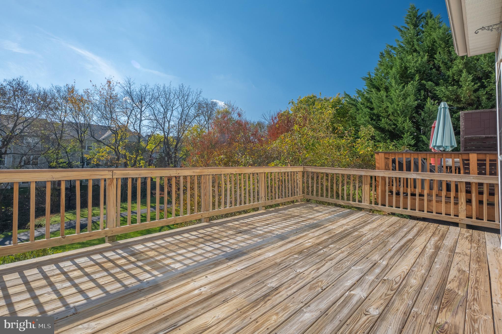 511 Ellison Court Frederick, MD 21703 - Photo 71 of 79 a balcony with wooden floor and trees in the background