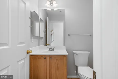 a large kitchen with cabinets and stainless steel appliances