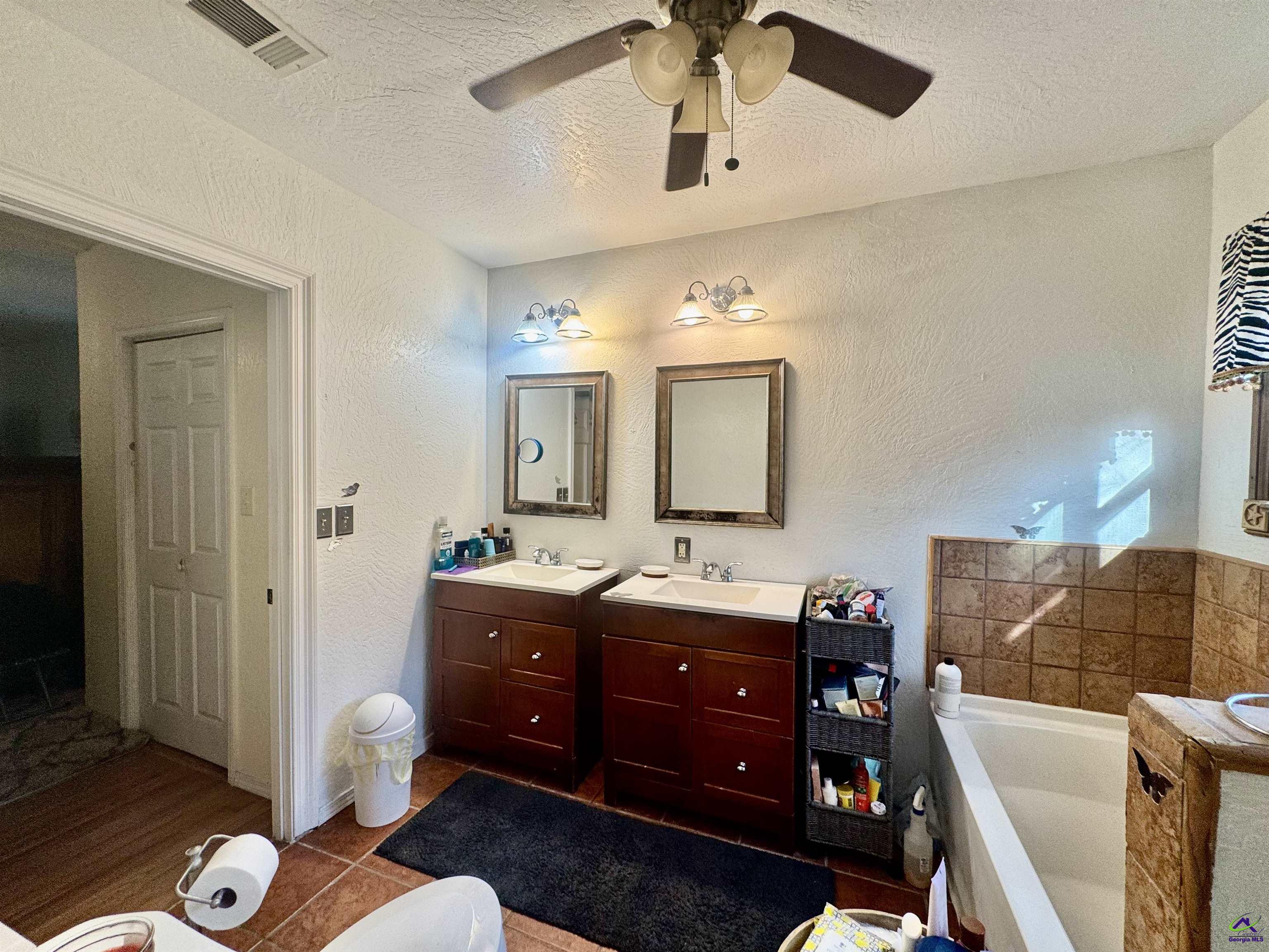 914 Adderton Street Americus, GA 31719 - Photo 30 of 53 a living room with furniture and a wooden floor