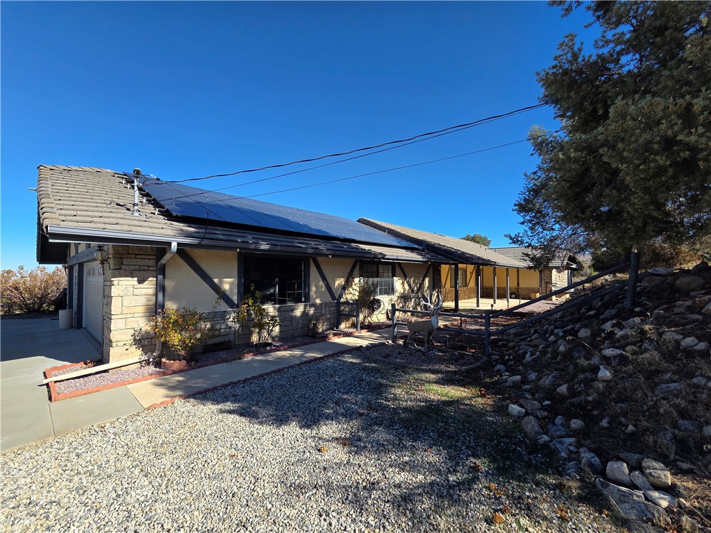 9539 Soledad Road Pinon Hills, CA 92372 - Photo 2 of 66 a view of a house with a patio