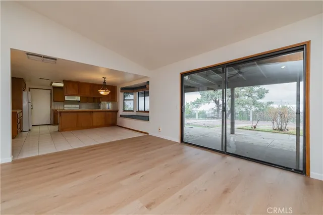 a kitchen with stainless steel appliances a refrigerator and cabinets