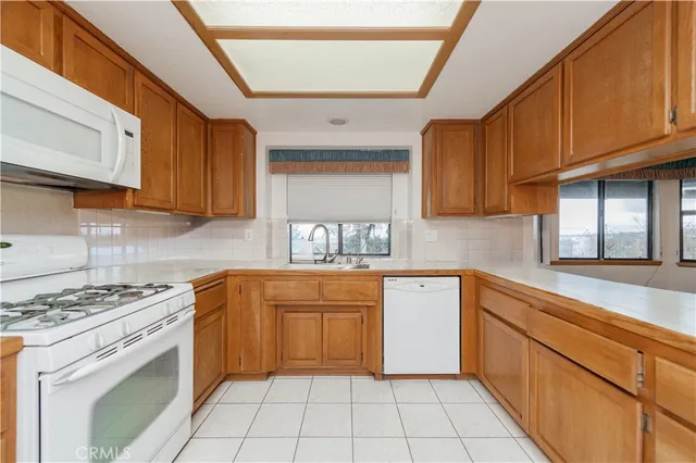 a view of an outdoor space with tub and windows