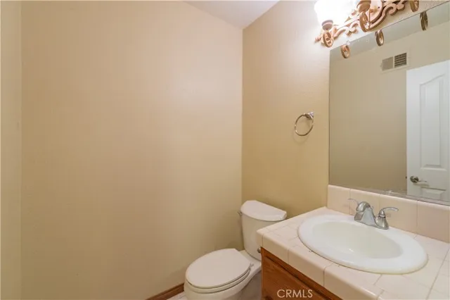 a bathroom with a tub shower and sink