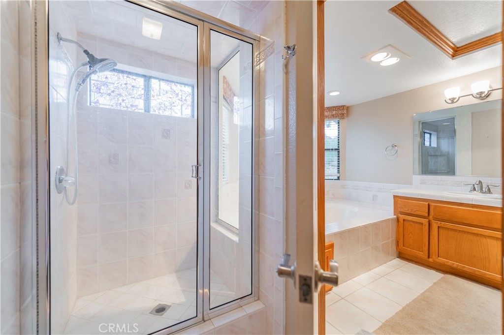 9539 Soledad Road Pinon Hills, CA 92372 - Photo 45 of 66 a bathroom with a tub shower and sink