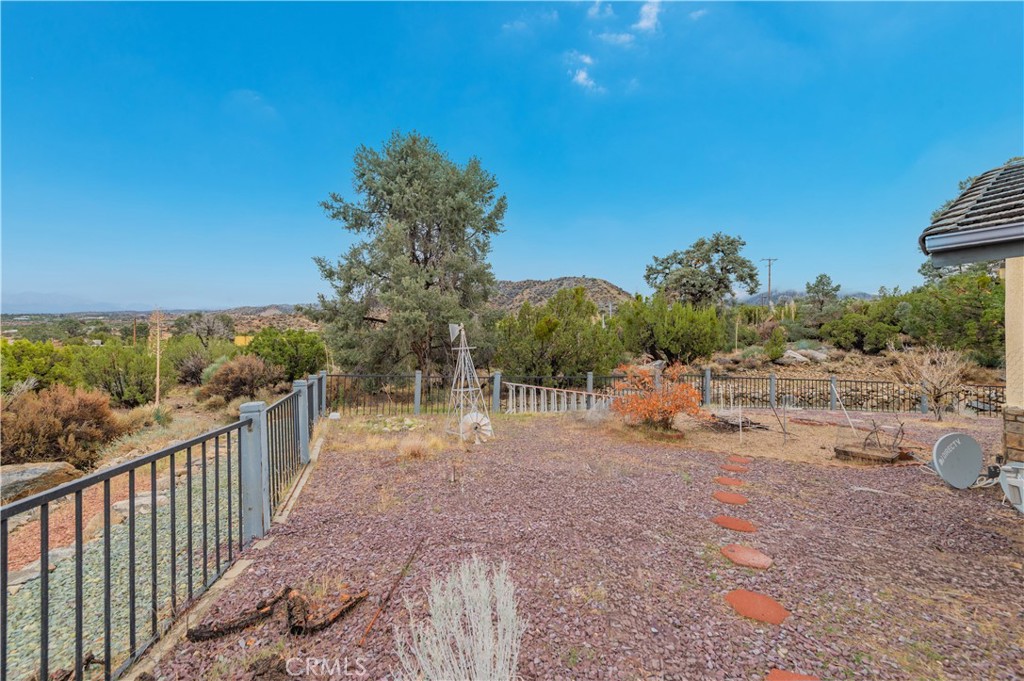 9539 Soledad Road Pinon Hills, CA 92372 - Photo 60 of 66 a view of a road with a yard