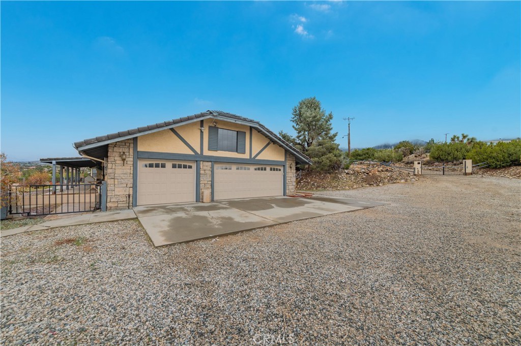 9539 Soledad Road Pinon Hills, CA 92372 - Photo 65 of 66 a view of a house with a yard
