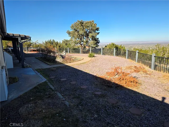 a view of a bench in a backyard