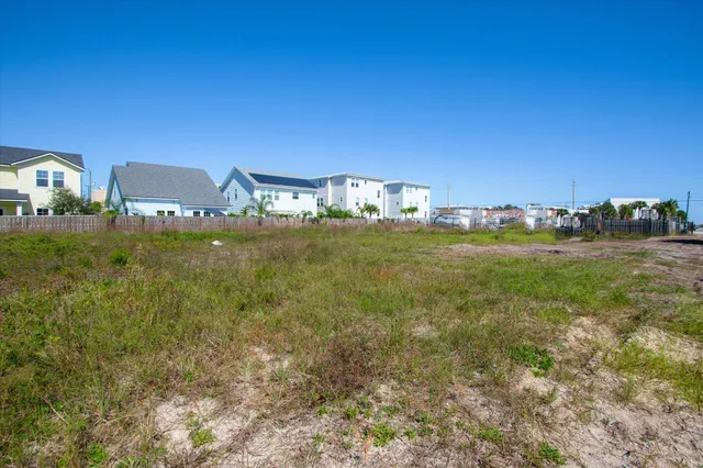 a view of a garden with a building in the background