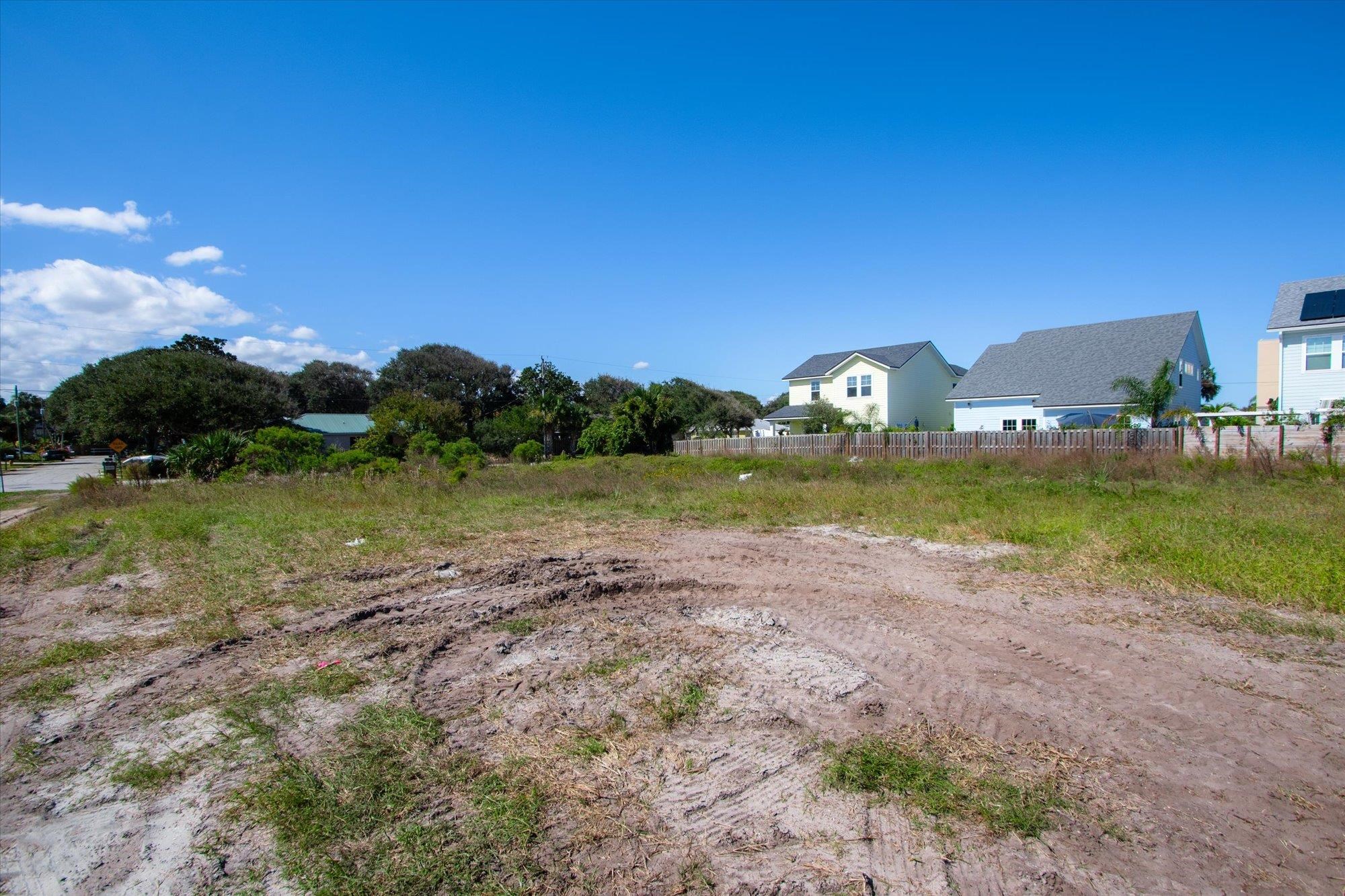 126 4th Street St. Augustine, FL 32080 - Photo 15 of 16 a view of a garden with a building in the background