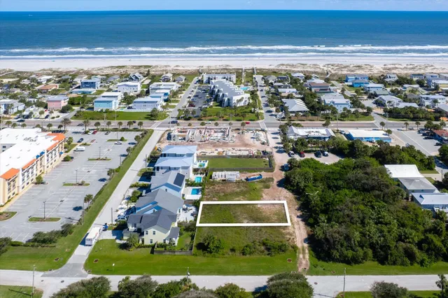 an aerial view of a house with a ocean view