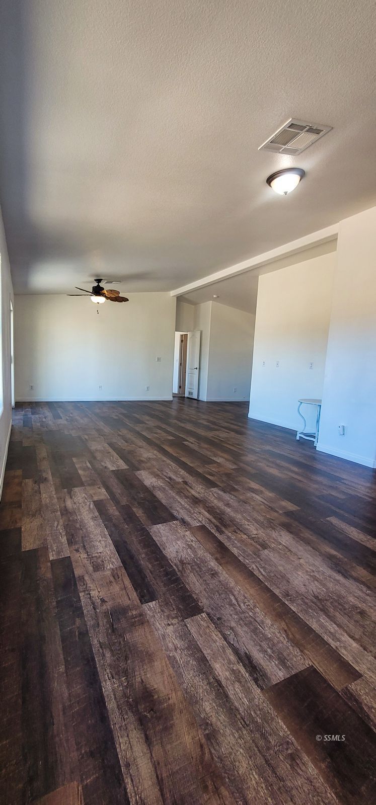 1056 North Alford Street Ridgecrest, CA 93555 - Photo 5 of 24 a view of a room with wooden floor