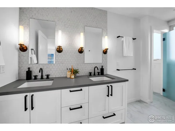 a view of bathroom with dual sinks