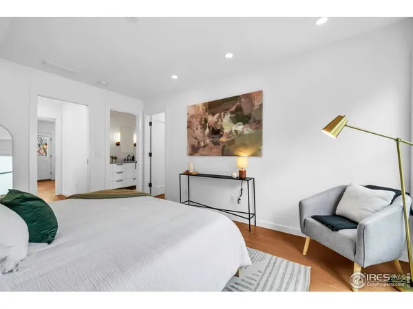 a bedroom with a bed and a couch