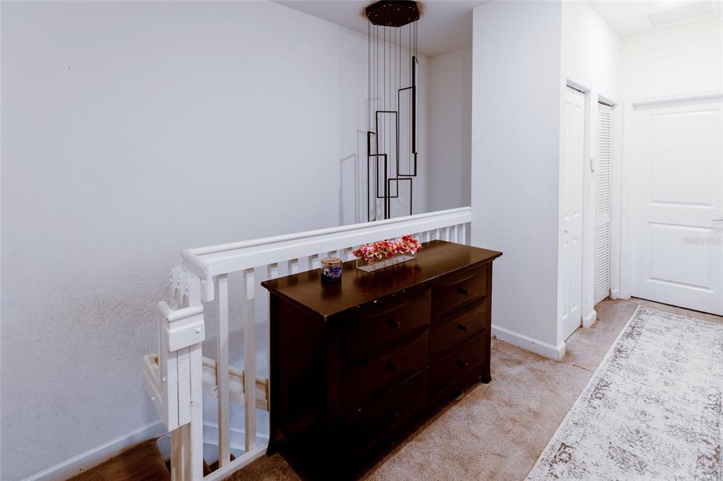 25190 Southwest 107th Avenue Homestead, FL 33032 - Photo 11 of 57 a room with a small white cabinets and a fireplace