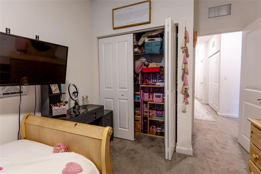 25190 Southwest 107th Avenue Homestead, FL 33032 - Photo 13 of 57 a bedroom with a bed and a closet