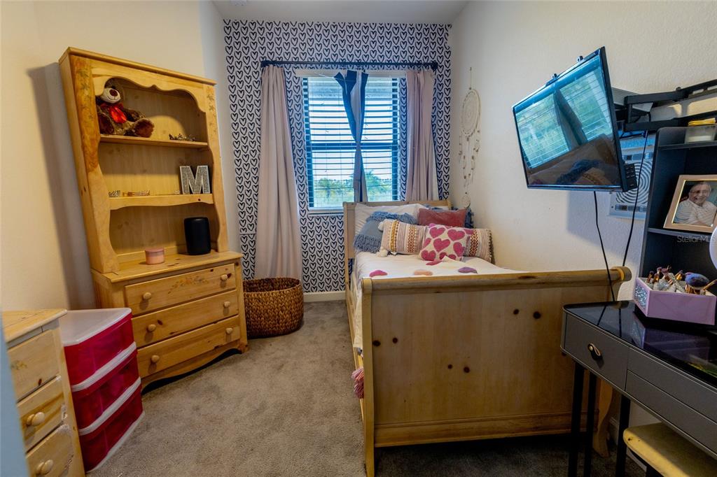 25190 Southwest 107th Avenue Homestead, FL 33032 - Photo 15 of 57 a room with furniture and baby crib