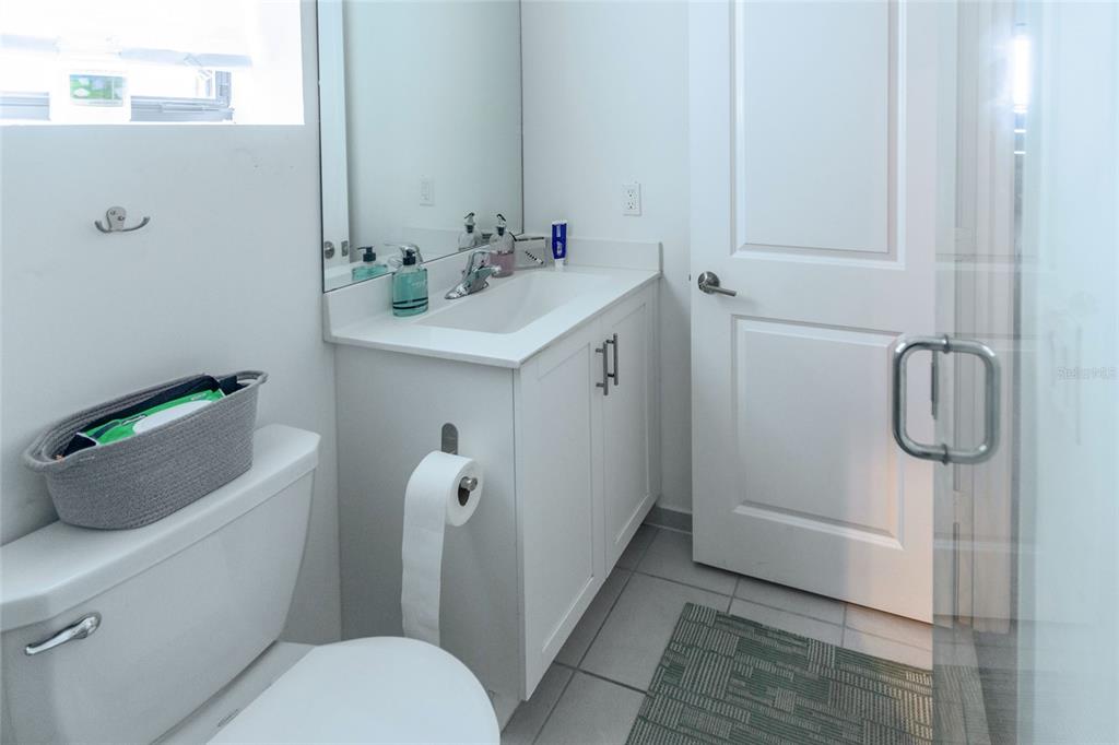 25190 Southwest 107th Avenue Homestead, FL 33032 - Photo 16 of 57 a bathroom with a sink a toilet and shower