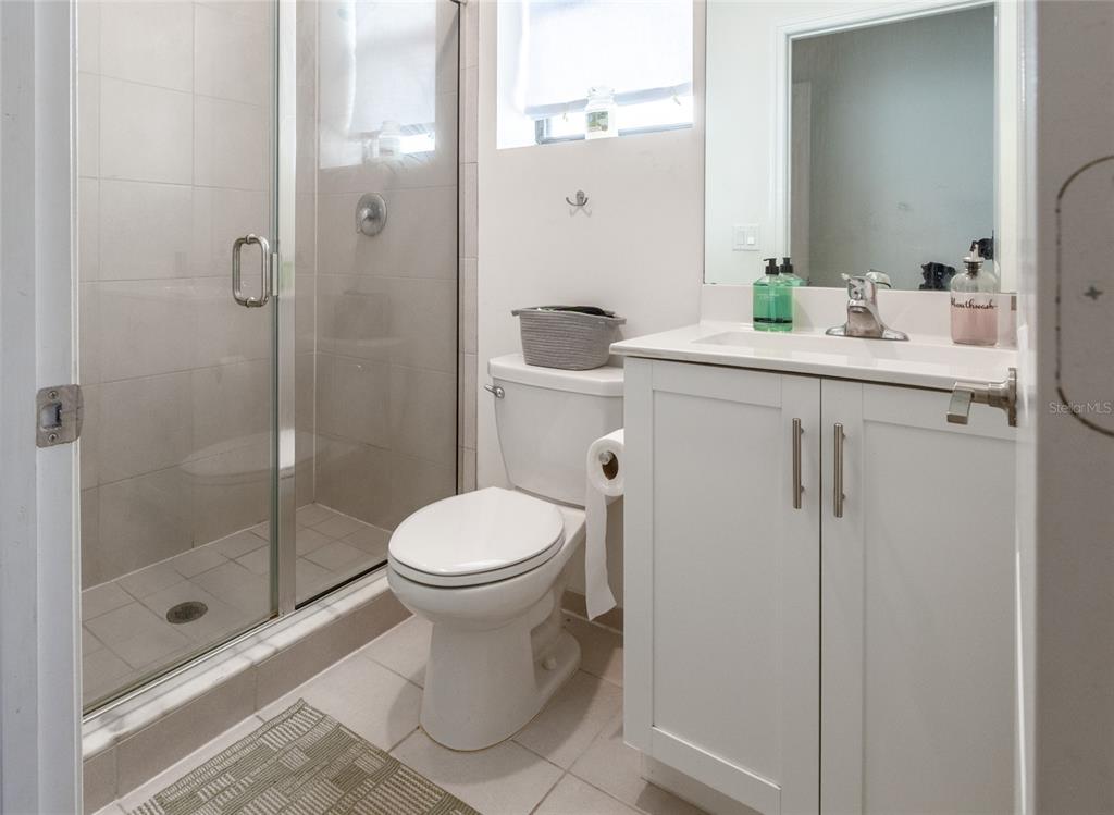 25190 Southwest 107th Avenue Homestead, FL 33032 - Photo 18 of 57 a bathroom with a toilet a sink and shower