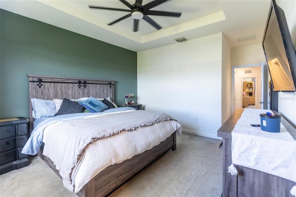 25190 Southwest 107th Avenue Homestead, FL 33032 - Photo 32 of 57 a bed sitting in a bedroom next to a window