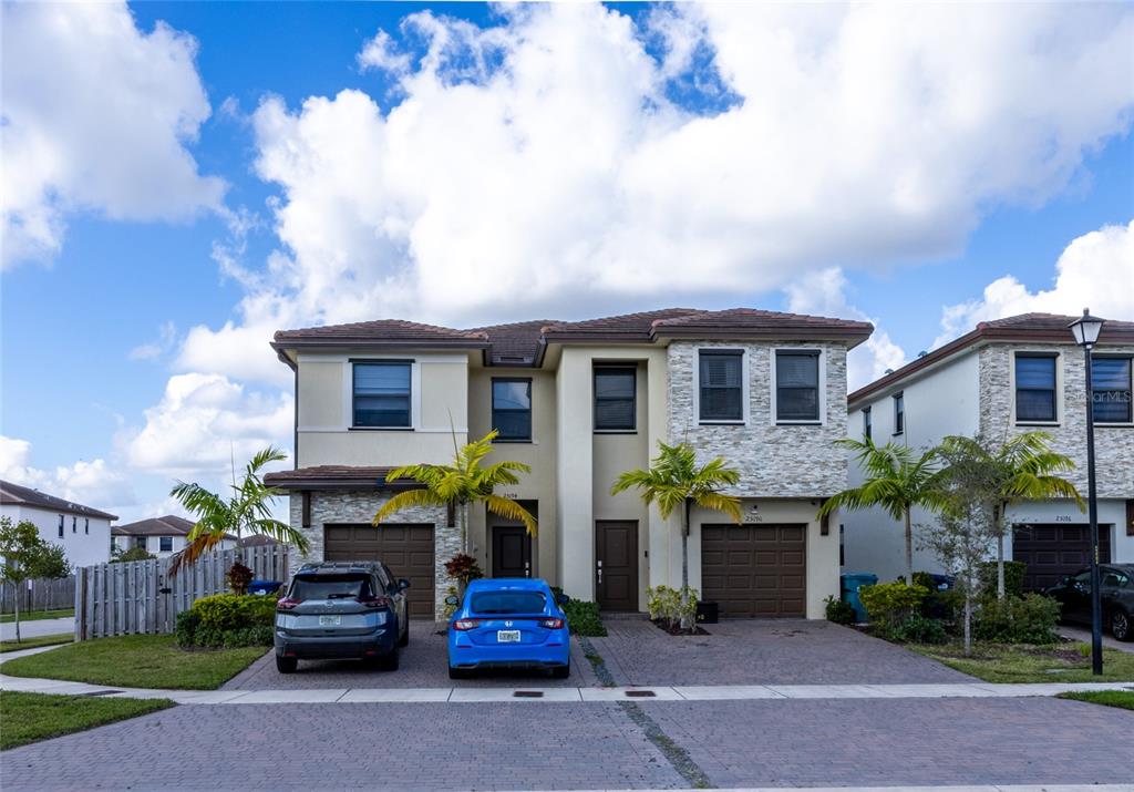 25190 Southwest 107th Avenue Homestead, FL 33032 - Photo 4 of 57 a view of house with outdoor space and car parked
