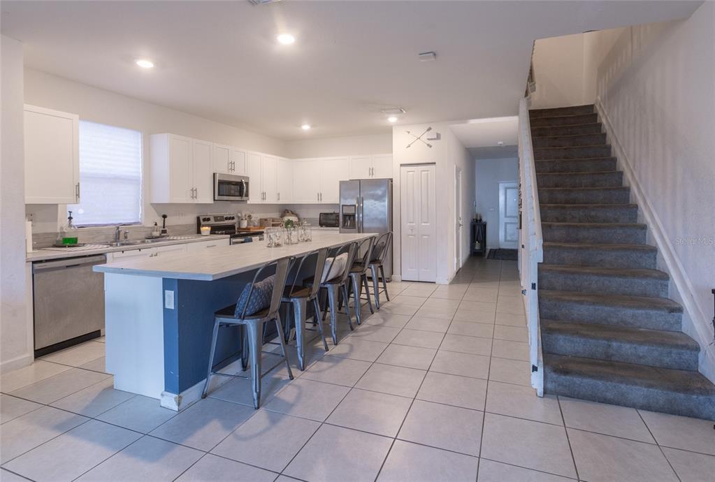 25190 Southwest 107th Avenue Homestead, FL 33032 - Photo 41 of 57 a kitchen with a sink a counter top space and cabinets