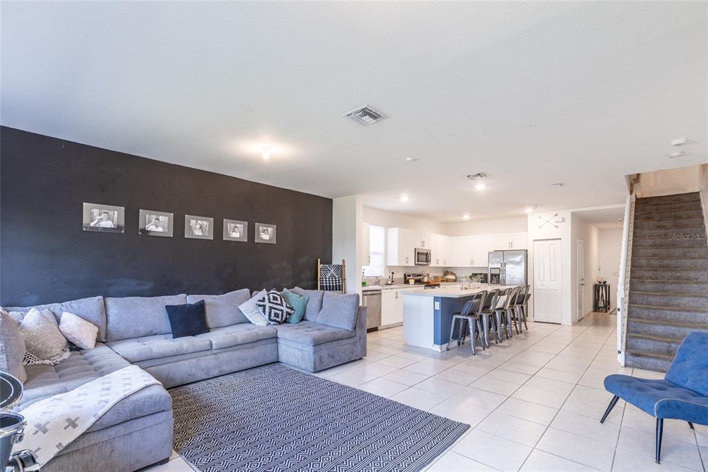 25190 Southwest 107th Avenue Homestead, FL 33032 - Photo 45 of 57 a living room with lots of furniture and kitchen view