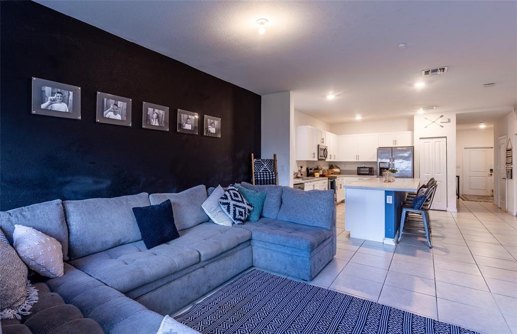 25190 Southwest 107th Avenue Homestead, FL 33032 - Photo 52 of 57 a living room with furniture and kitchen view