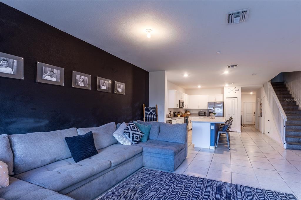 25190 Southwest 107th Avenue Homestead, FL 33032 - Photo 53 of 57 a living room with furniture and kitchen view