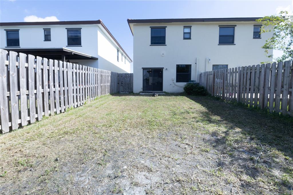 25190 Southwest 107th Avenue Homestead, FL 33032 - Photo 56 of 57 a view of a house with wooden fence