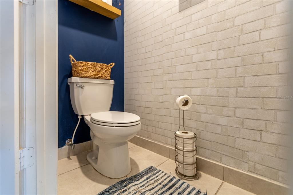 25190 Southwest 107th Avenue Homestead, FL 33032 - Photo 6 of 57 a bathroom with a toilet and a shower