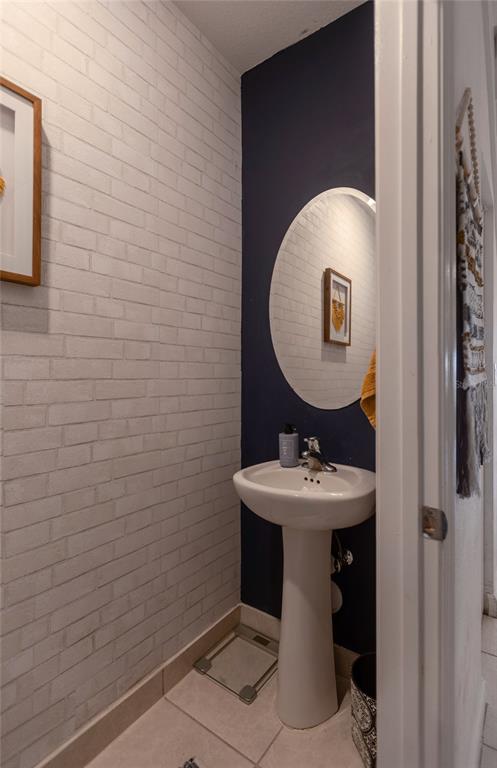 25190 Southwest 107th Avenue Homestead, FL 33032 - Photo 7 of 57 a bathroom with a sink toilet and mirror