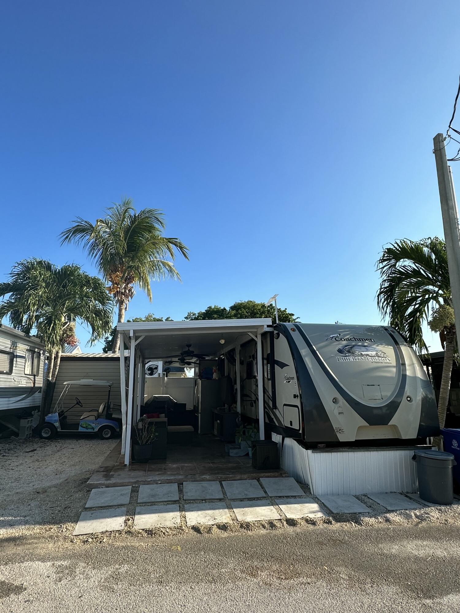 325 Calusa Street, Unit 9 Key Largo, FL 33037 - Photo 11 of 29 a view of a car parked on the side of the road