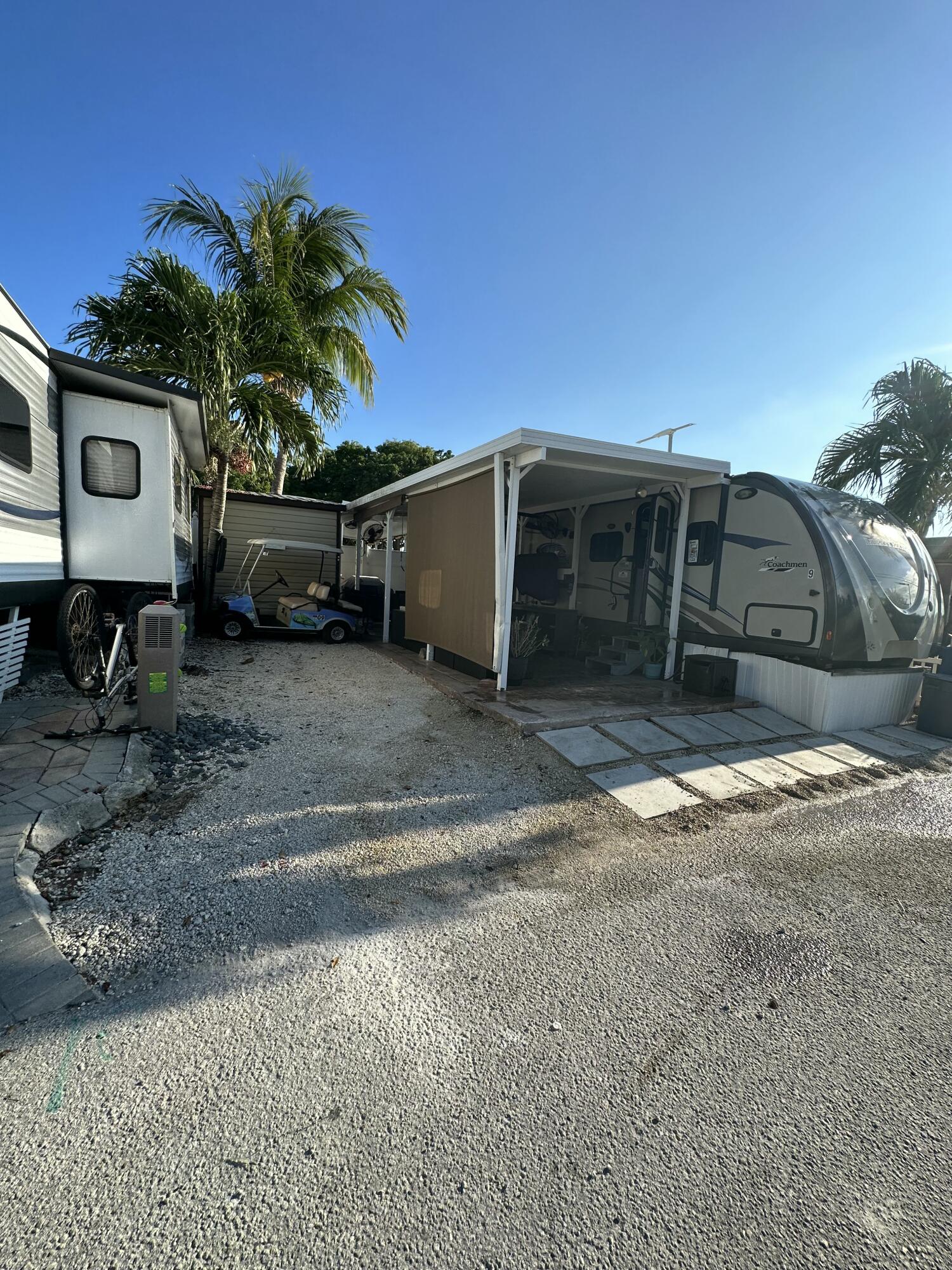 325 Calusa Street, Unit 9 Key Largo, FL 33037 - Photo 3 of 29 a view of a car parked in front of a house