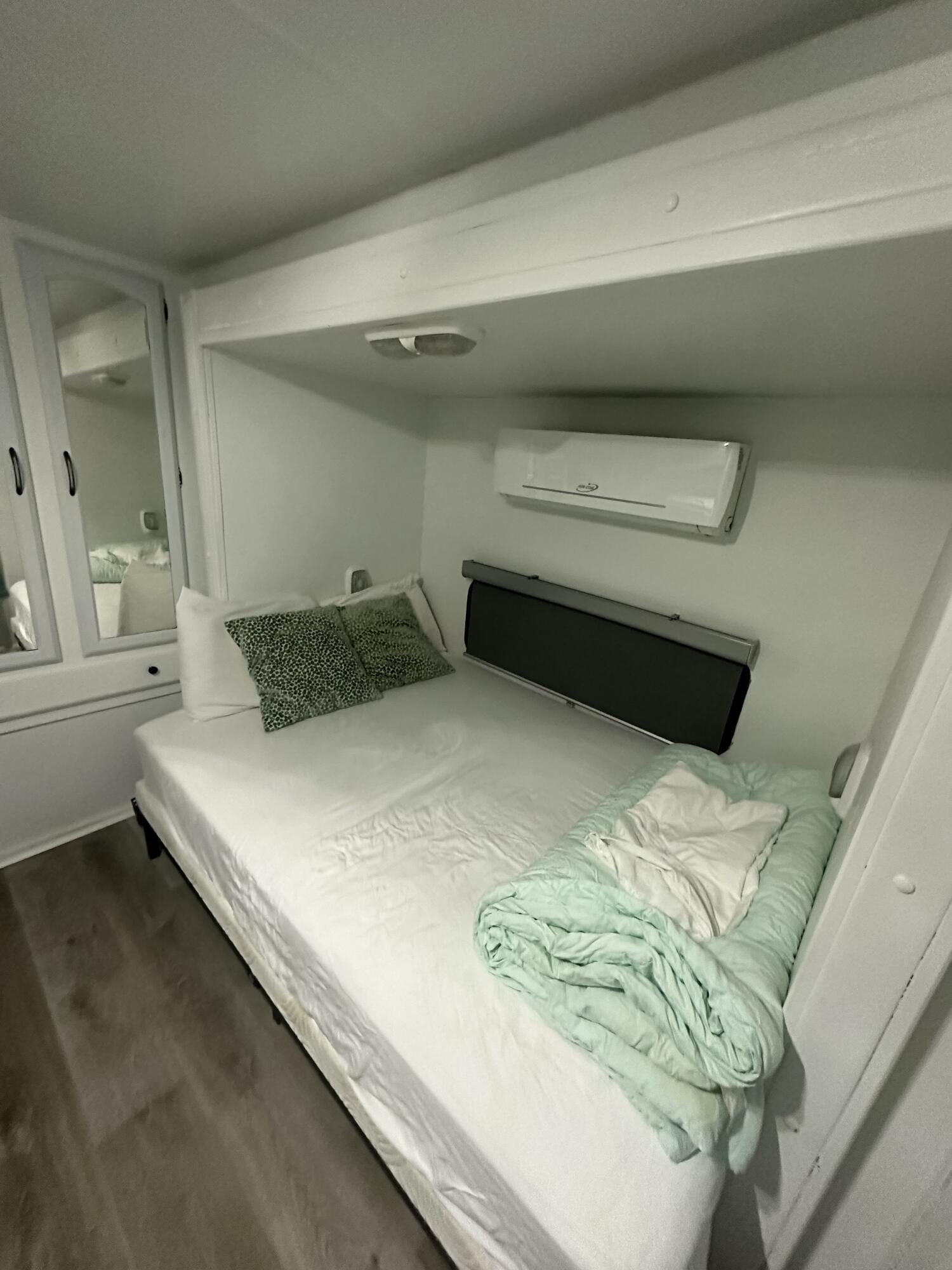 325 Calusa Street, Unit 9 Key Largo, FL 33037 - Photo 8 of 29 a bedroom with a bed and a window