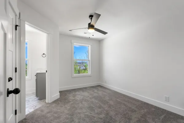 a view of an empty room with a window